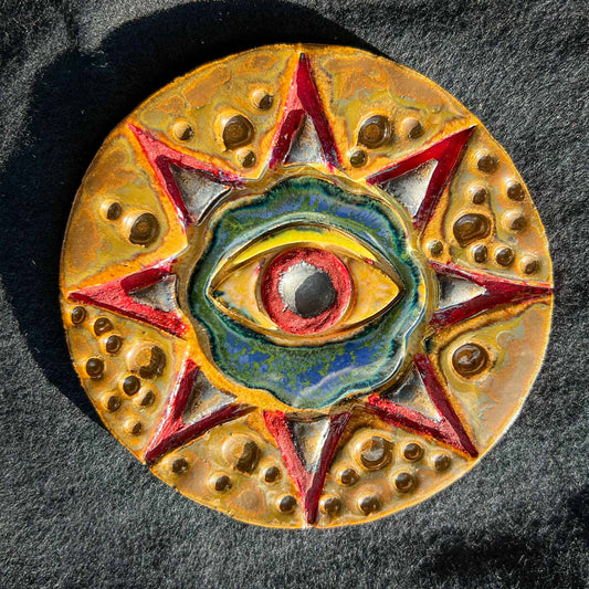 Melas Ceramic Red Eye Mandala Wall Art Earthy; eye; art; ceramic; wall art; Melasdesign Handmade; Mela's Eye Collection; one of a kind; sold by artist; decor accent; red eye; eye in star mandala