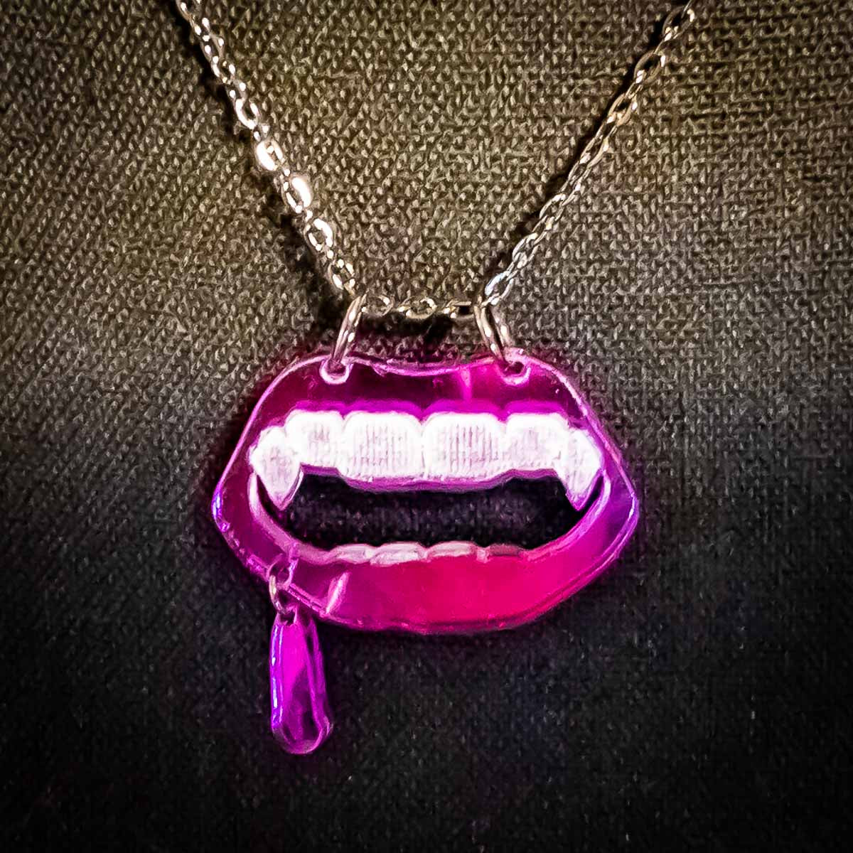 vamp necklace; purple; dripping; mouth; fangs; Melasdesign; peculiar; artist; jewelry; WV designer