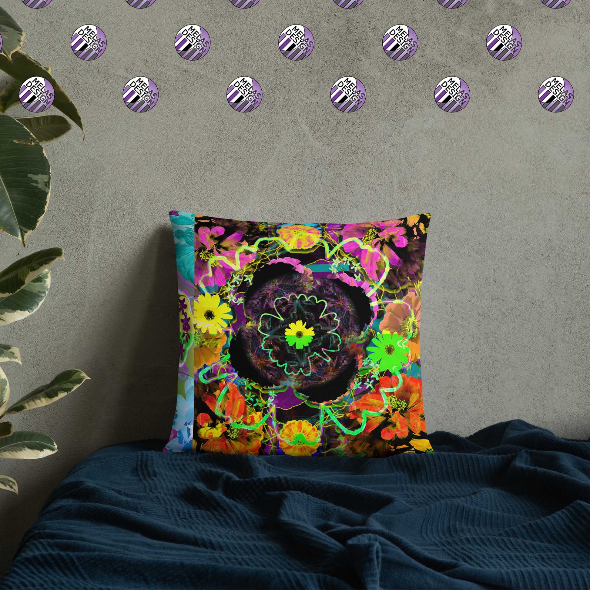 Color Joy Flower Power Throw Pillow v3; 18x18; product mock-up on bed with plant and Melasdesign logos