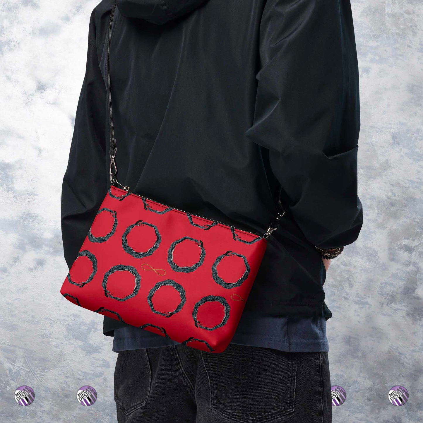 Ouroboros Infinity Cross-Body Bag Red Black; product mock-up worn cross-body from back of male model; Melasdesign logos