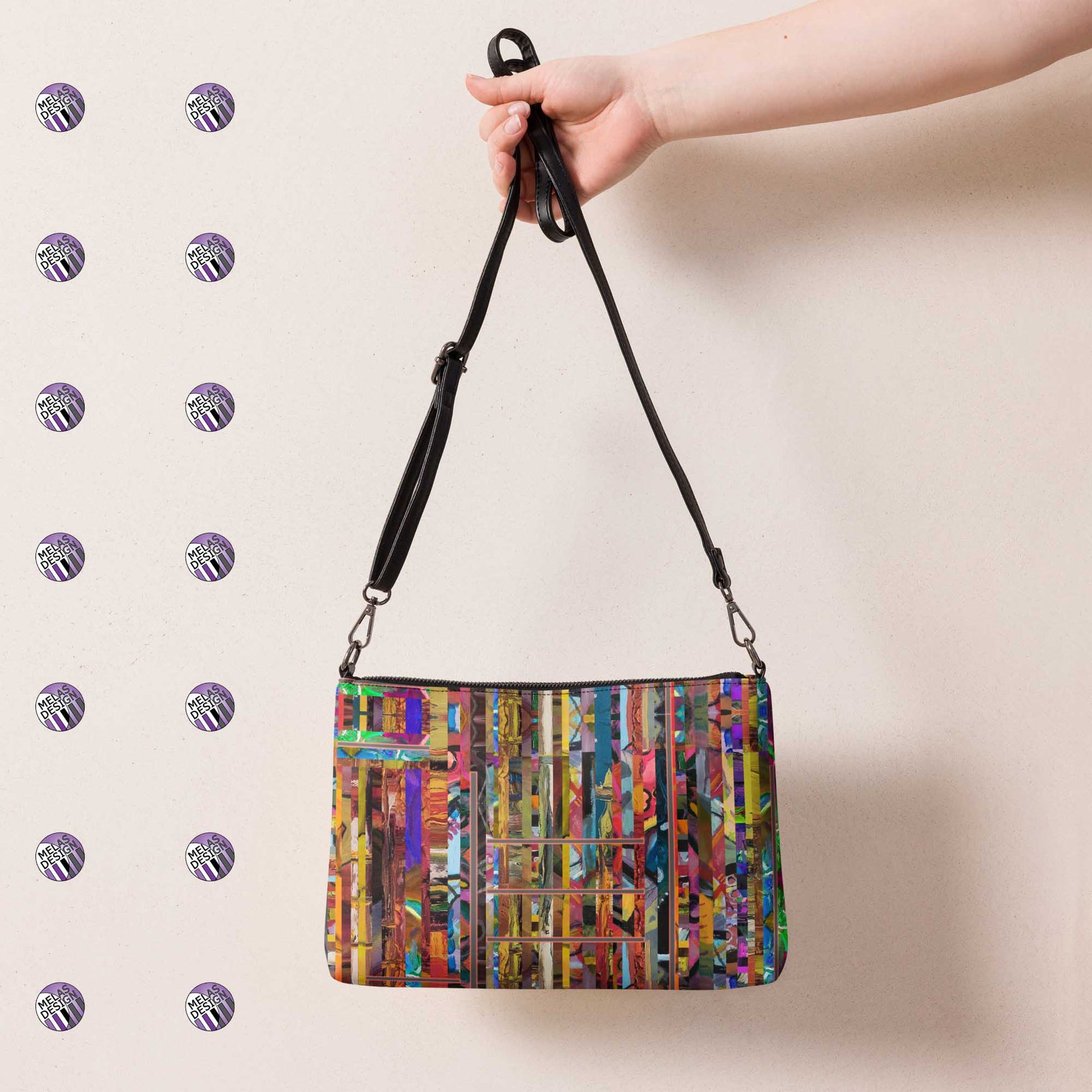 Stripped Striped Abstract Cross-Body Bag; product mockup back view hanging from extended hand; Melasdesign logos