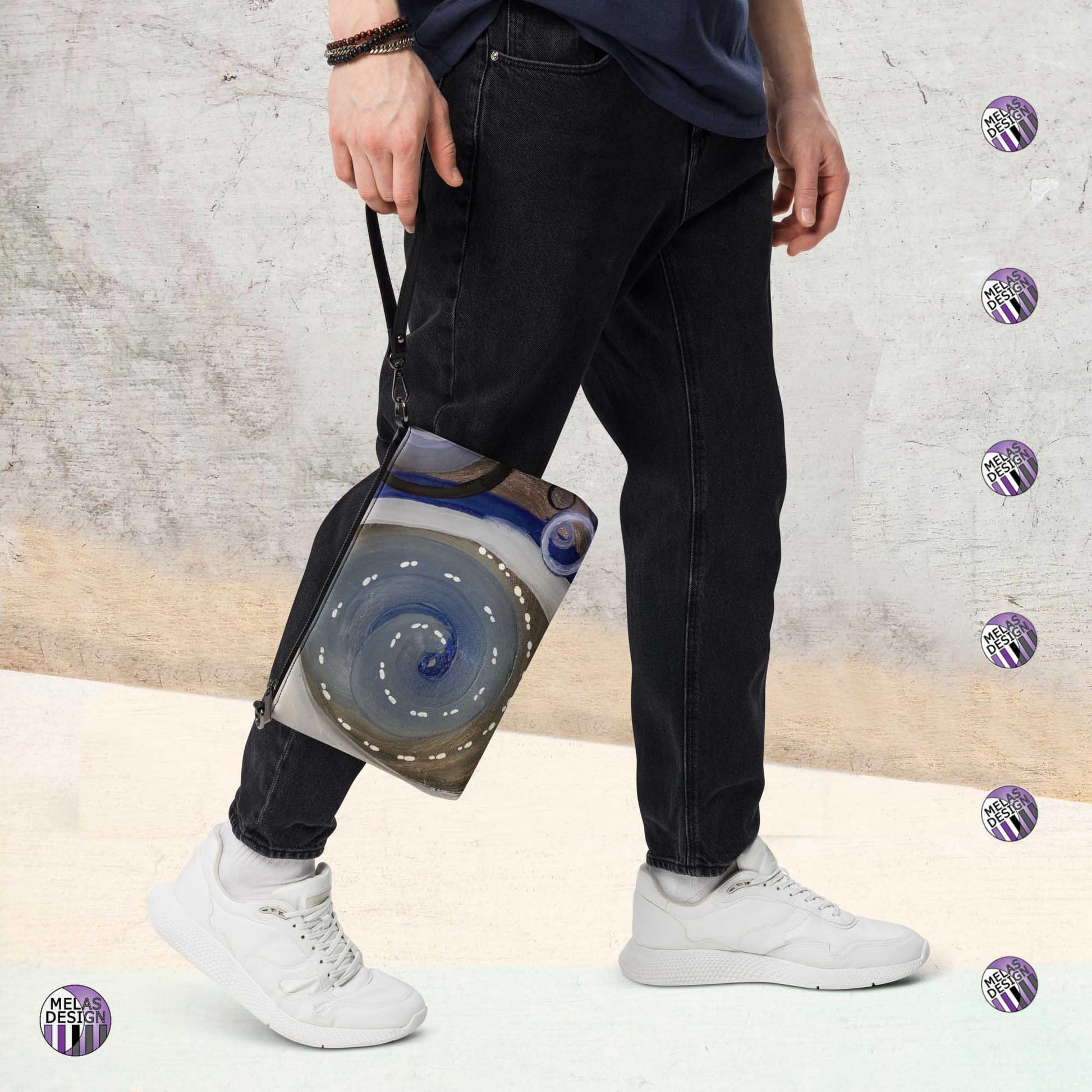 Empowering Spectrum Cross-Body Bag Toast; product mockup showing front held by wrist strap by male model; Melasdesign logos