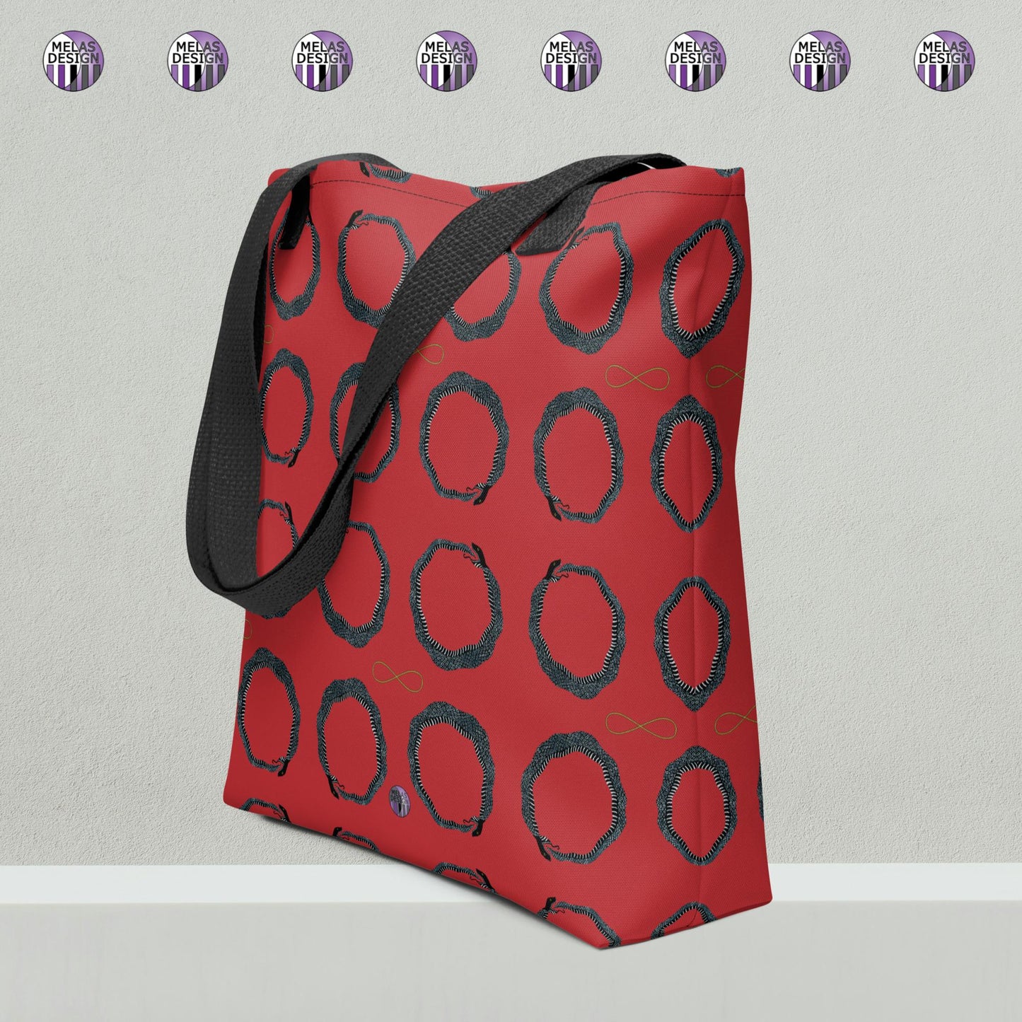 Ouroboros Infinity Pattern Tote Bag Red Black; Product mockup angled view with melasdesign logos against gray background