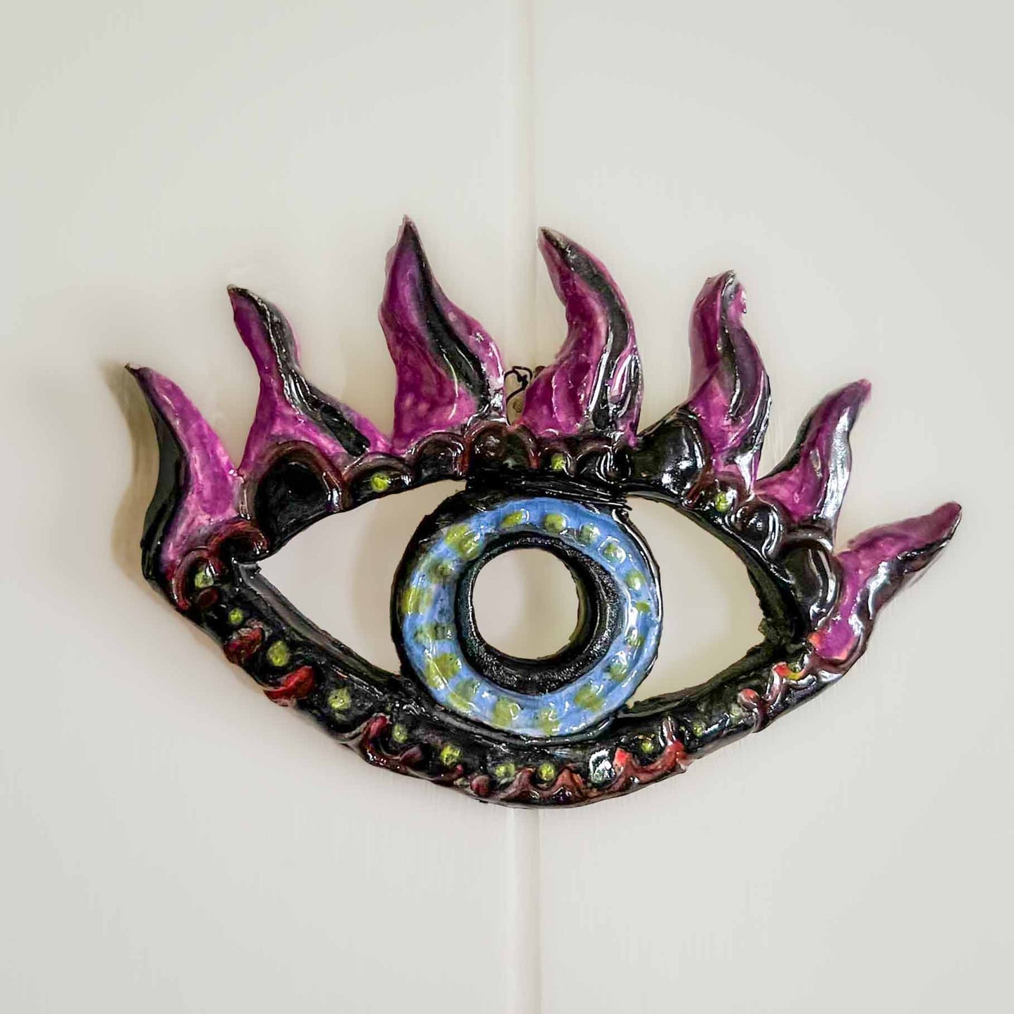 Melas Ceramic Eye Wall Art Black Blue Purple; hand built; hand building; ceramics; pottery; sculptural; trippy; witchy; alternative; wall art; decor; Melas Eye Collection; Art and Decor Collection; Melasdesign Handmade; Thomas WV