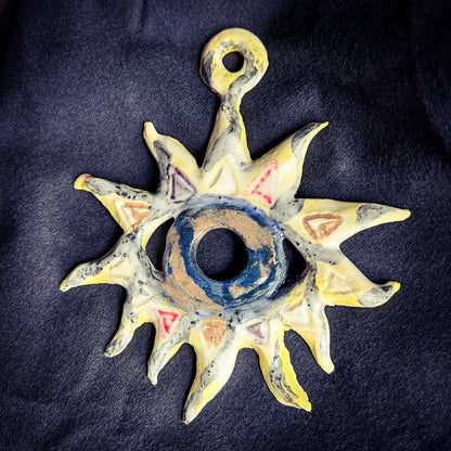Melas Eye in the Sun Ceramic Wall Art