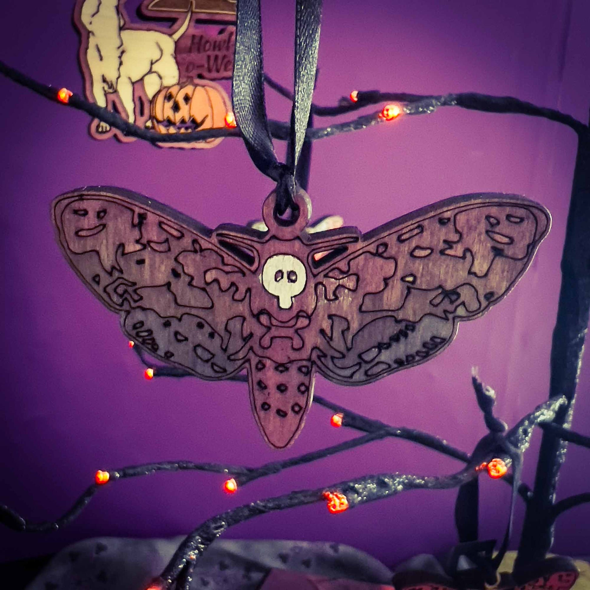 Deaths Head Moth Ornament in Colorful Wood; Melasdesign Handmade; Thomas WV; hanging decor; ornament; moth; deaths head moth; wood; small business; witchy decor; gothic decor; art and decor collection; Halloween decor