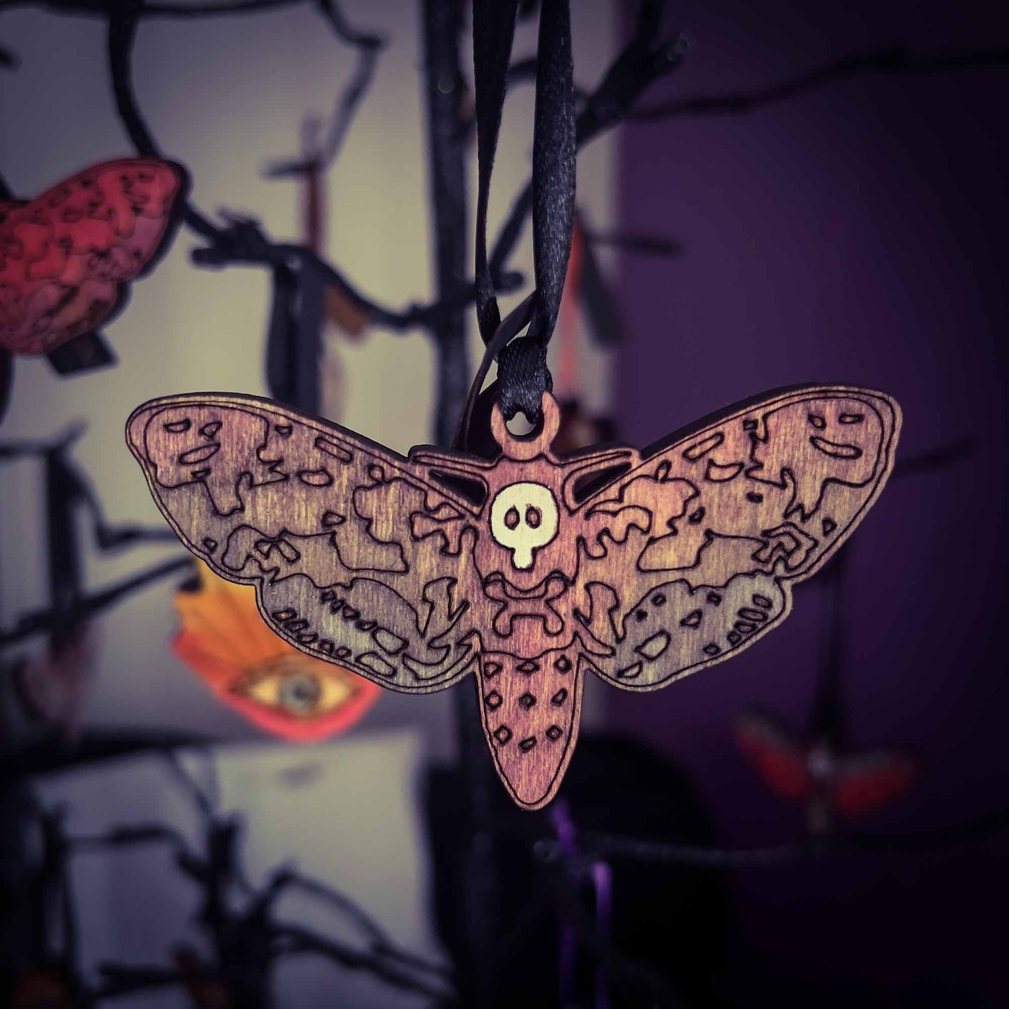 Deaths Head Moth Ornament in Colorful Wood; Melasdesign Handmade; Thomas WV; hanging decor; ornament; moth; deaths head moth; wood; small business; witchy decor; gothic decor; art and decor collection; Halloween decor