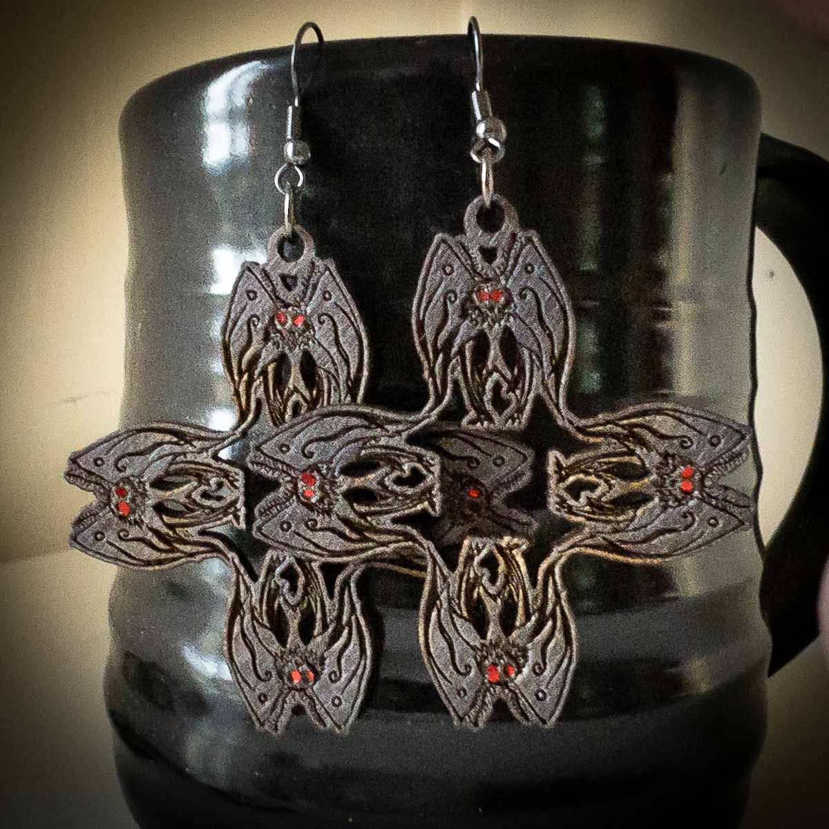 Mothman Cryptid Earrings in Black; mothman pattern earrings; Melasdesign Handmade Darkness; Cryptid Collection; cryptid earrings; Mothman earrings; Mothman jewelry; made in West Virginia