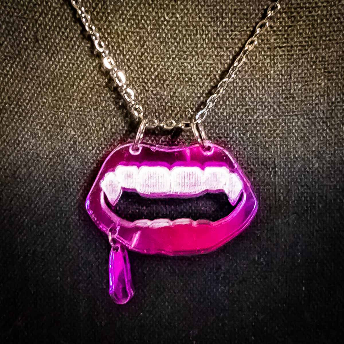 vamp necklace; purple; dripping; mouth; fangs; Melasdesign; peculiar; artist; jewelry;  WV designer